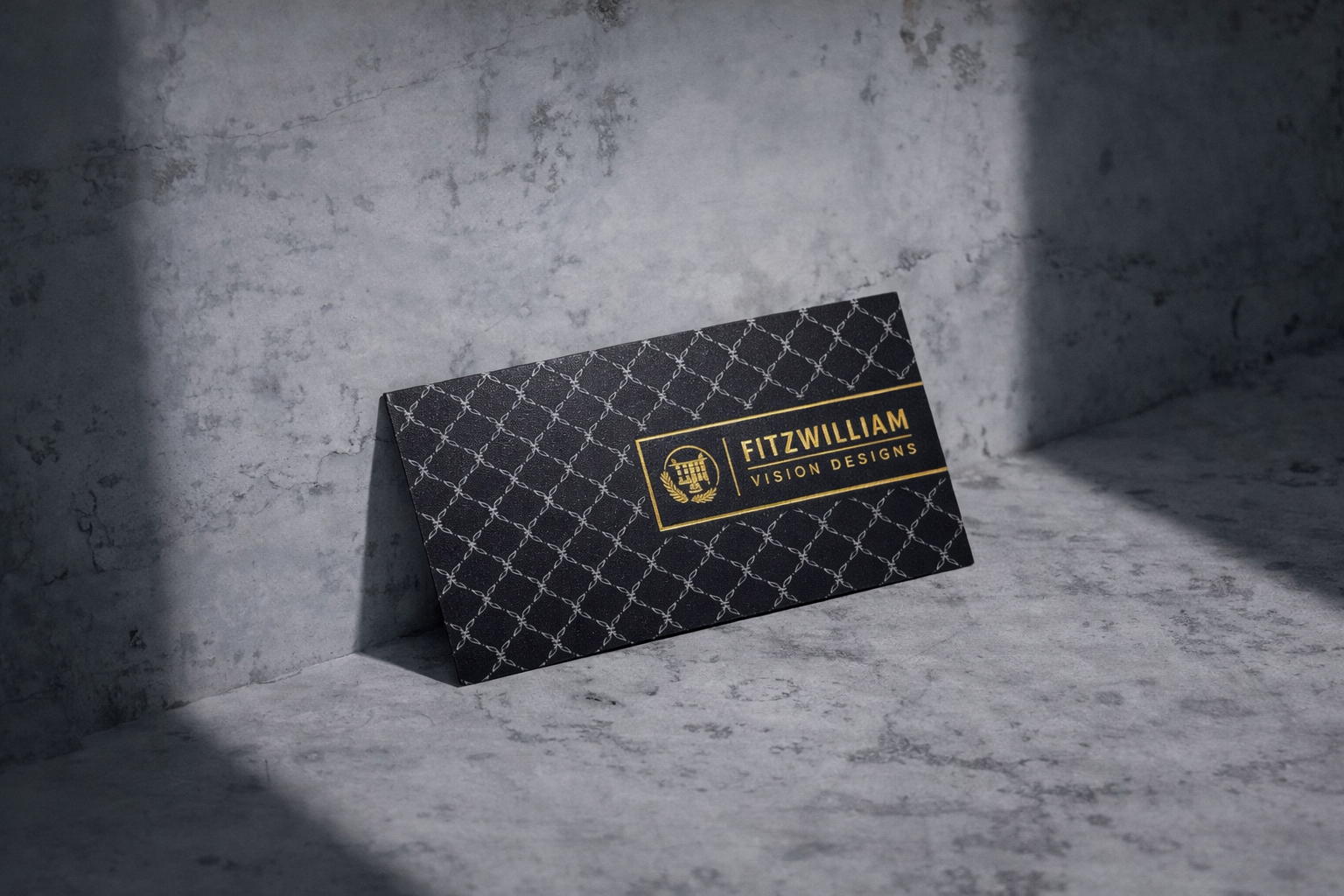Luxury business cards in Ireland with a trellis pattern, gold foil logo and typography, gold edge gilding, and embossed reverse detailing.